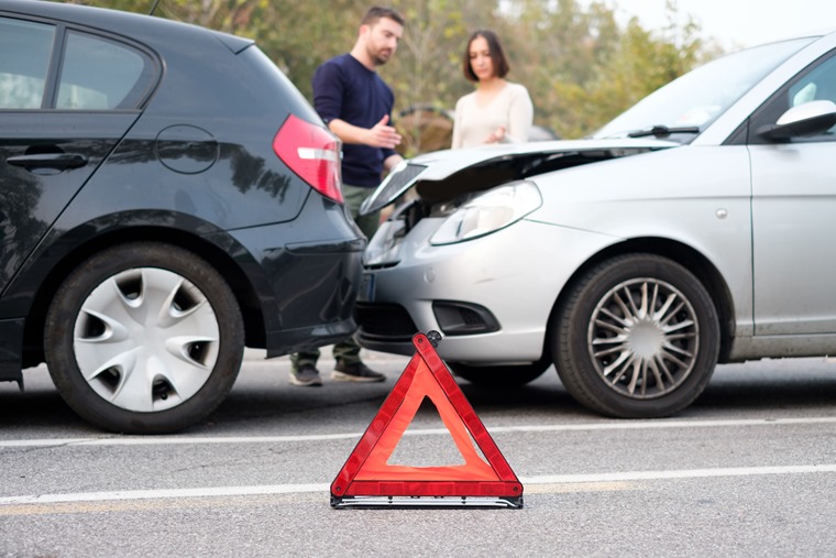 People checking car damages after car accident