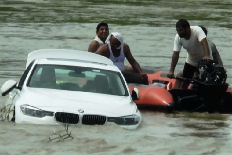An ungrateful birthday boy pushed his BMW into a river because he wanted a Jaguar