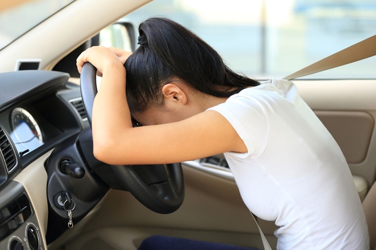 49933044 - sad woman driver in car