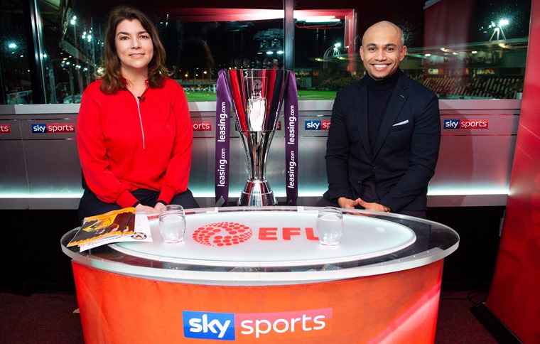Sky sports presenters in the studio with the Leasing.com trophy
